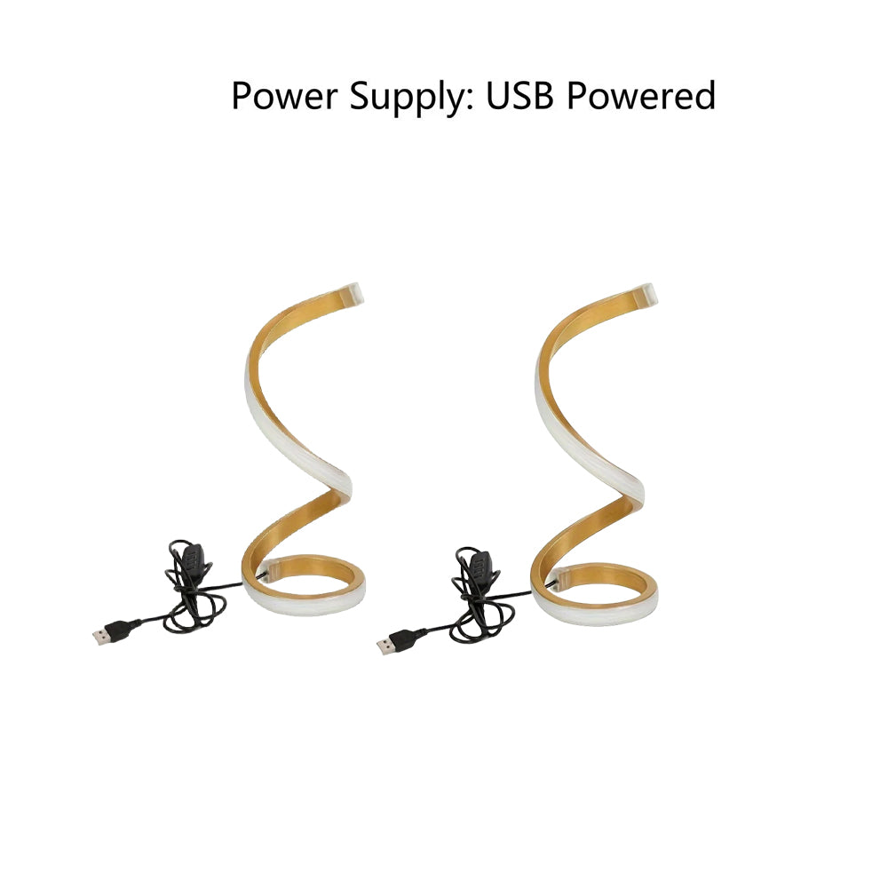 Aura Spiral gold sculptural LED lamp pair on console table